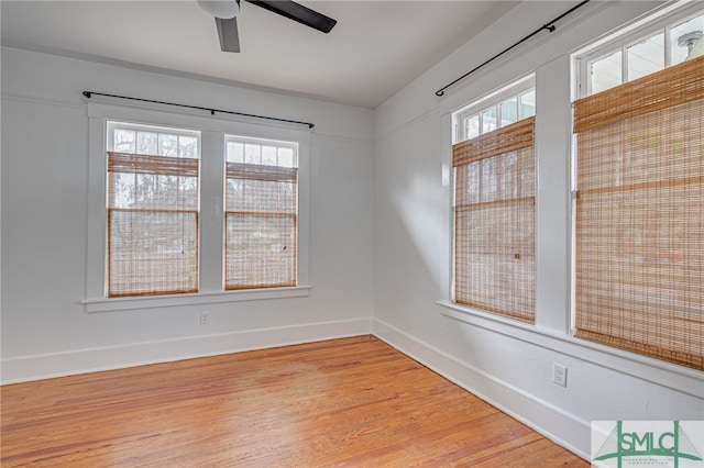 empty room featuring ceiling fan and light hardwood / wood-style floors