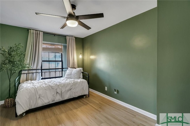 bedroom featuring ceiling fan and light hardwood / wood-style flooring