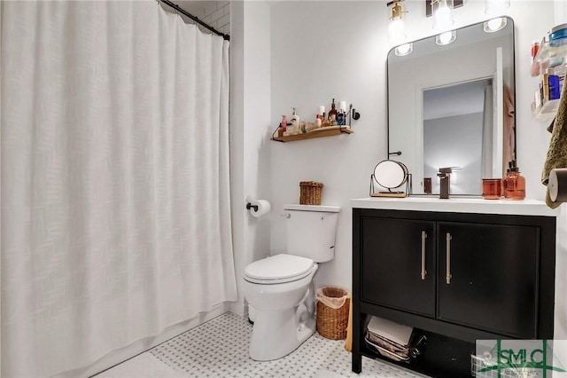 bathroom featuring tile patterned flooring, vanity, toilet, and a shower with curtain