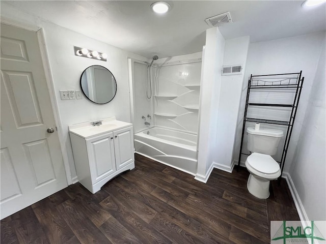 full bathroom featuring vanity, toilet, wood-type flooring, and shower / tub combination