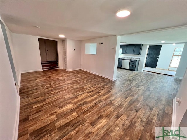 unfurnished living room featuring dark wood-type flooring