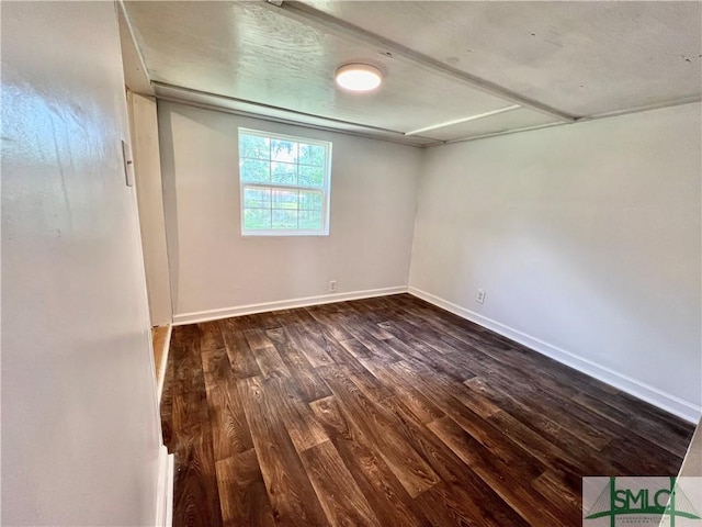 empty room with dark wood-type flooring