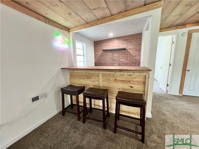 bar with dark colored carpet and wood ceiling