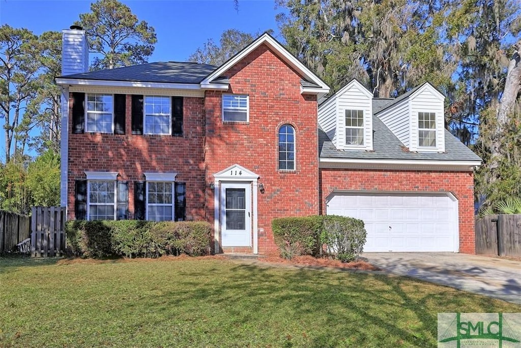 view of front facade featuring a front lawn and a garage