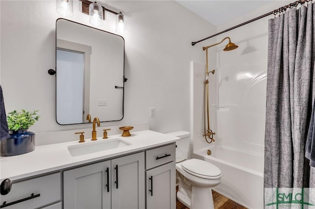 full bathroom featuring wood-type flooring, vanity, toilet, and shower / bathtub combination with curtain