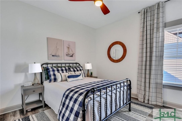 bedroom featuring ceiling fan and wood-type flooring