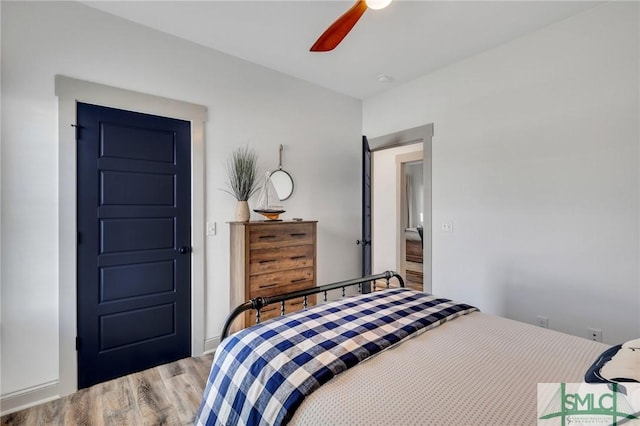 bedroom featuring light hardwood / wood-style flooring and ceiling fan