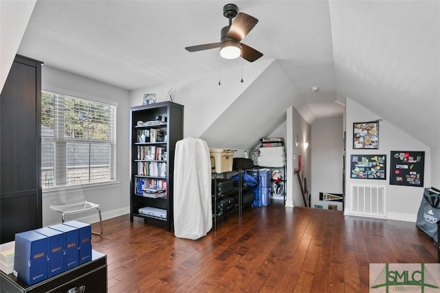 interior space with lofted ceiling, ceiling fan, and dark hardwood / wood-style floors