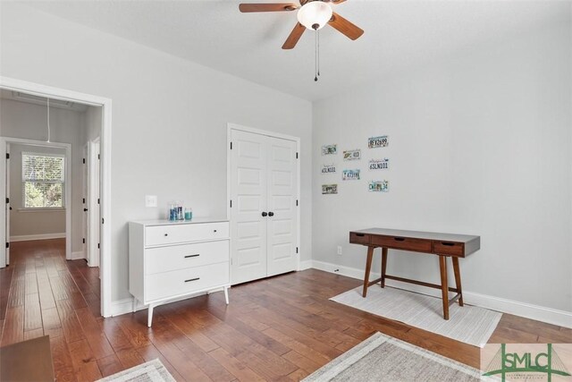 bedroom featuring dark hardwood / wood-style floors and ceiling fan