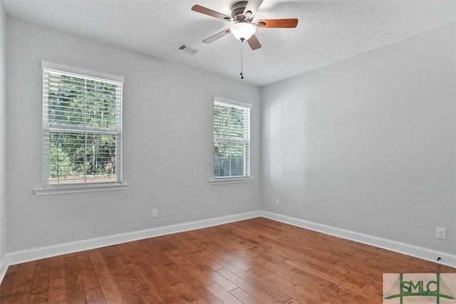 unfurnished room with wood-type flooring and ceiling fan