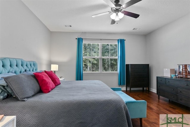 bedroom featuring ceiling fan and dark hardwood / wood-style flooring