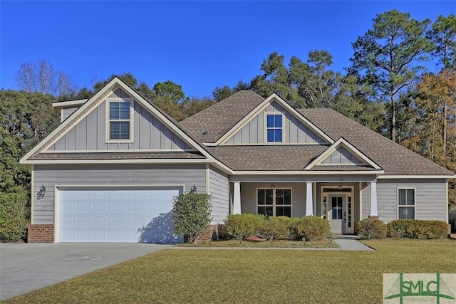 craftsman-style house featuring a front yard and a garage