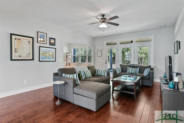 living room with dark hardwood / wood-style floors and ceiling fan