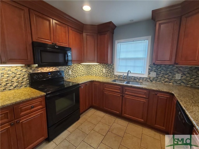 kitchen with decorative backsplash, sink, and black appliances