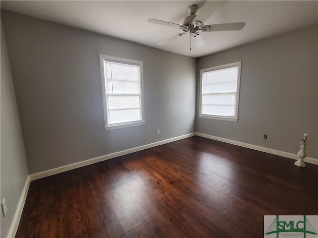 unfurnished room with ceiling fan and dark hardwood / wood-style flooring