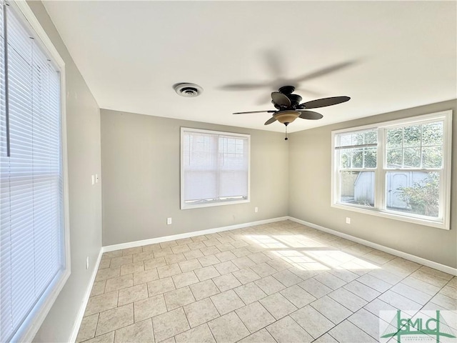 unfurnished room with light tile patterned floors, visible vents, baseboards, and ceiling fan