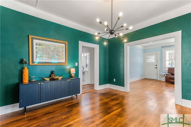 interior space featuring a chandelier and hardwood / wood-style flooring