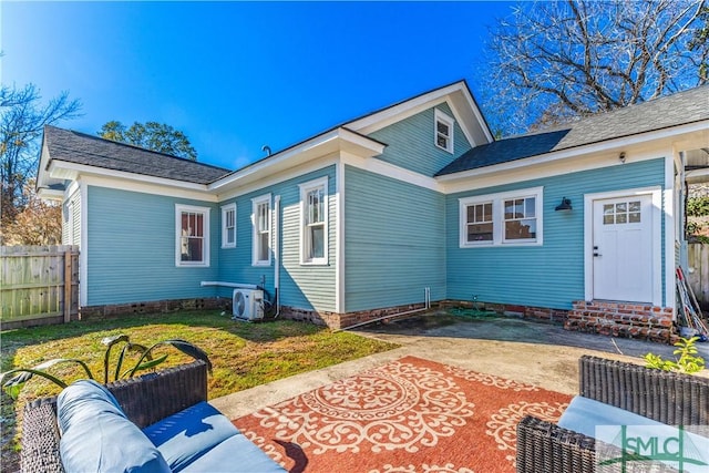 rear view of house featuring a lawn, ac unit, a patio area, and an outdoor hangout area