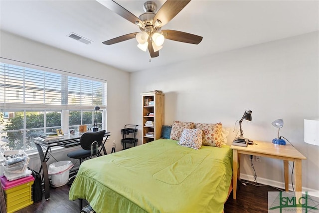 bedroom featuring dark hardwood / wood-style flooring and ceiling fan