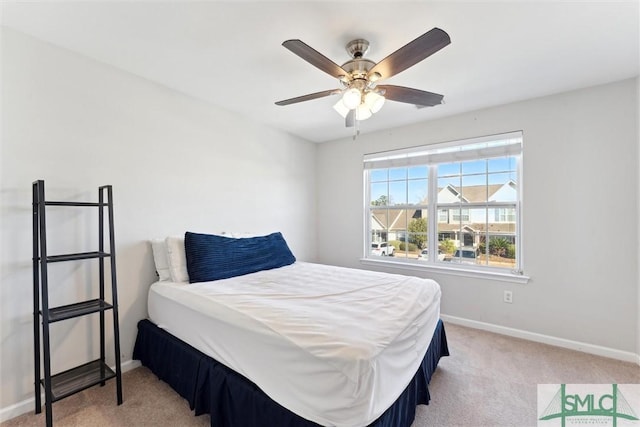 carpeted bedroom with ceiling fan