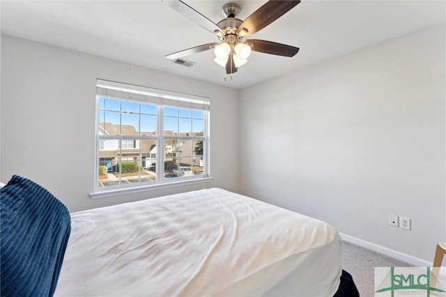 bedroom with light carpet and ceiling fan