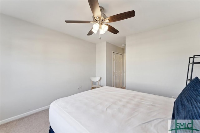 bedroom featuring carpet, ceiling fan, and a closet