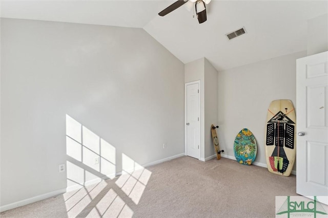 playroom with light carpet, ceiling fan, and vaulted ceiling