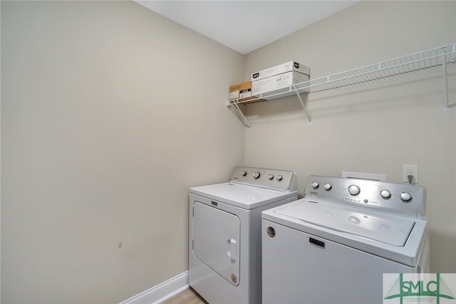 washroom featuring independent washer and dryer