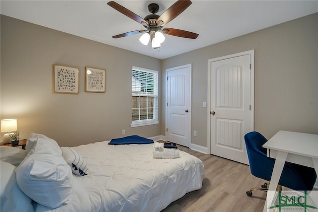 bedroom featuring ceiling fan and light hardwood / wood-style floors