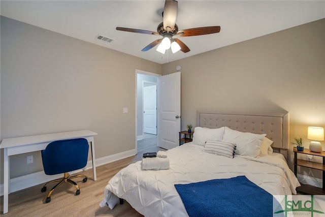 bedroom featuring light hardwood / wood-style floors and ceiling fan