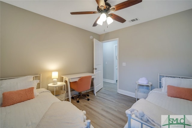 bedroom with ceiling fan and light hardwood / wood-style flooring