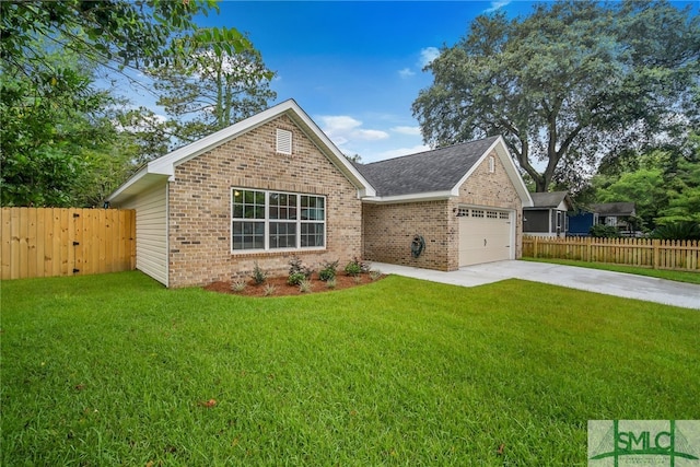 view of front facade with a front yard and a garage