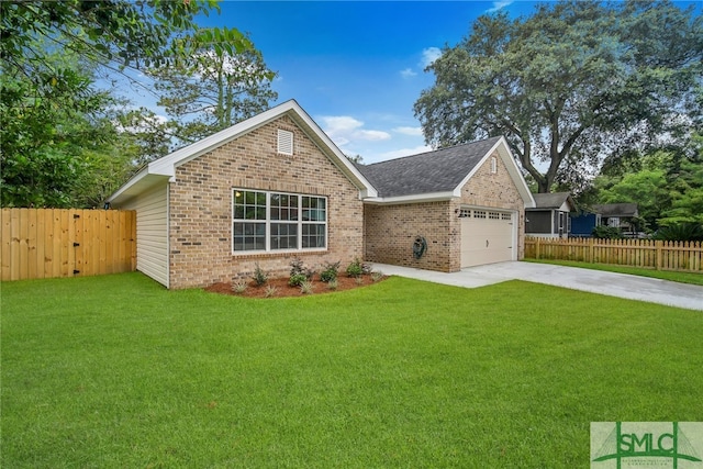 view of front of house featuring a garage and a front lawn