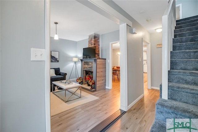 living room with light hardwood / wood-style flooring