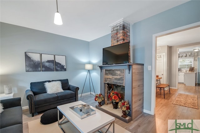 living room with light hardwood / wood-style flooring