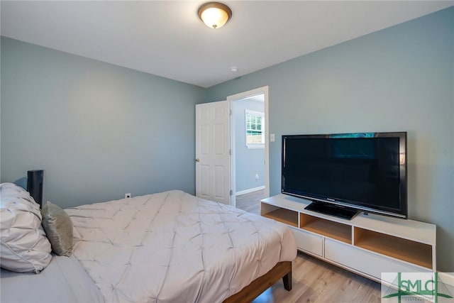 bedroom with light hardwood / wood-style flooring