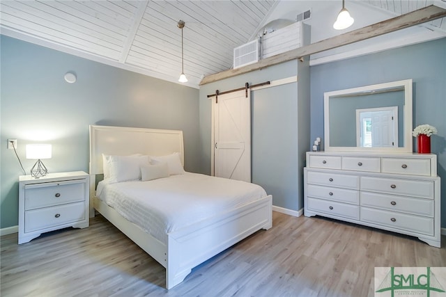 bedroom with wooden ceiling, high vaulted ceiling, a barn door, light wood-type flooring, and beam ceiling