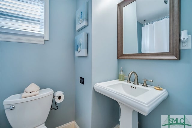 bathroom with toilet and sink