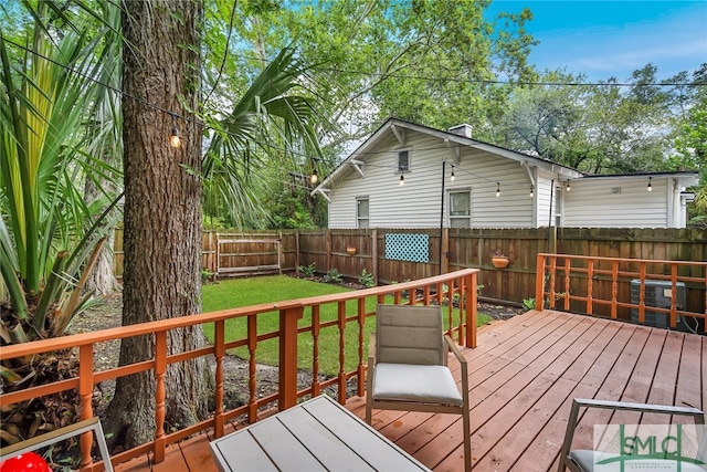 wooden deck with a yard