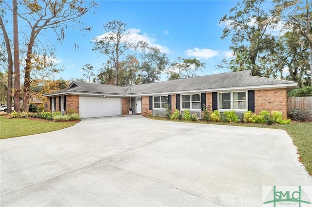 ranch-style house featuring a garage and a front lawn