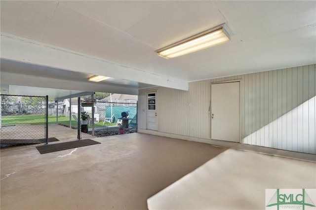 garage featuring wood walls