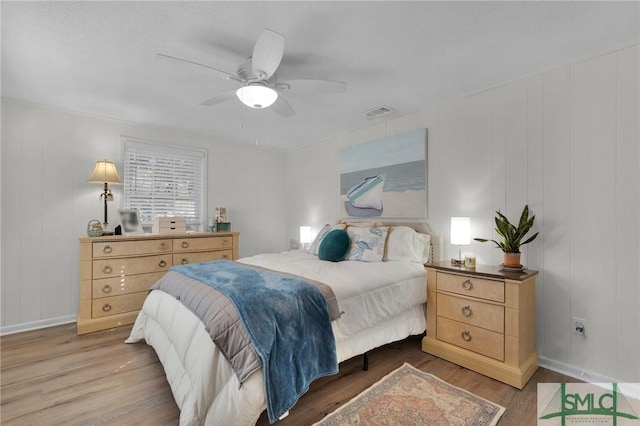 bedroom featuring hardwood / wood-style flooring and ceiling fan