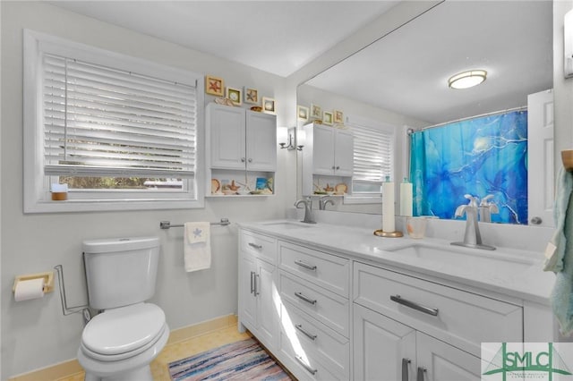 bathroom with tile patterned flooring, vanity, toilet, and a shower with shower curtain