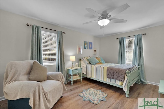 bedroom with ceiling fan and hardwood / wood-style floors