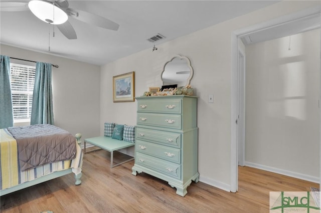 bedroom with ceiling fan and light wood-type flooring