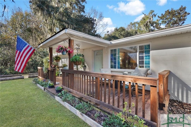 view of home's exterior with a yard and a deck