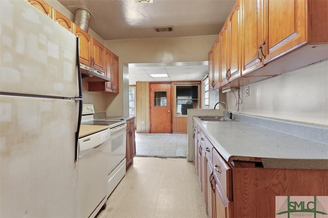 kitchen with sink and white appliances