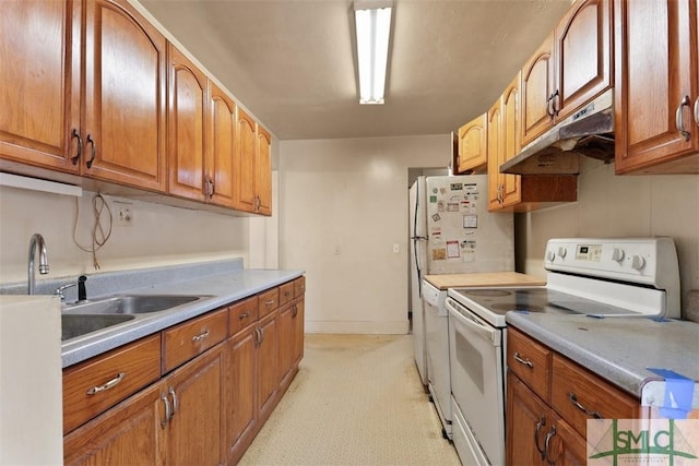 kitchen with white range with electric stovetop and sink