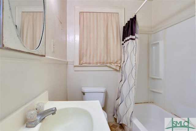 full bathroom with shower / bath combo, toilet, and sink