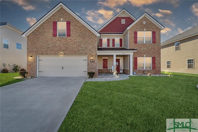 view of front of home featuring a lawn and a garage